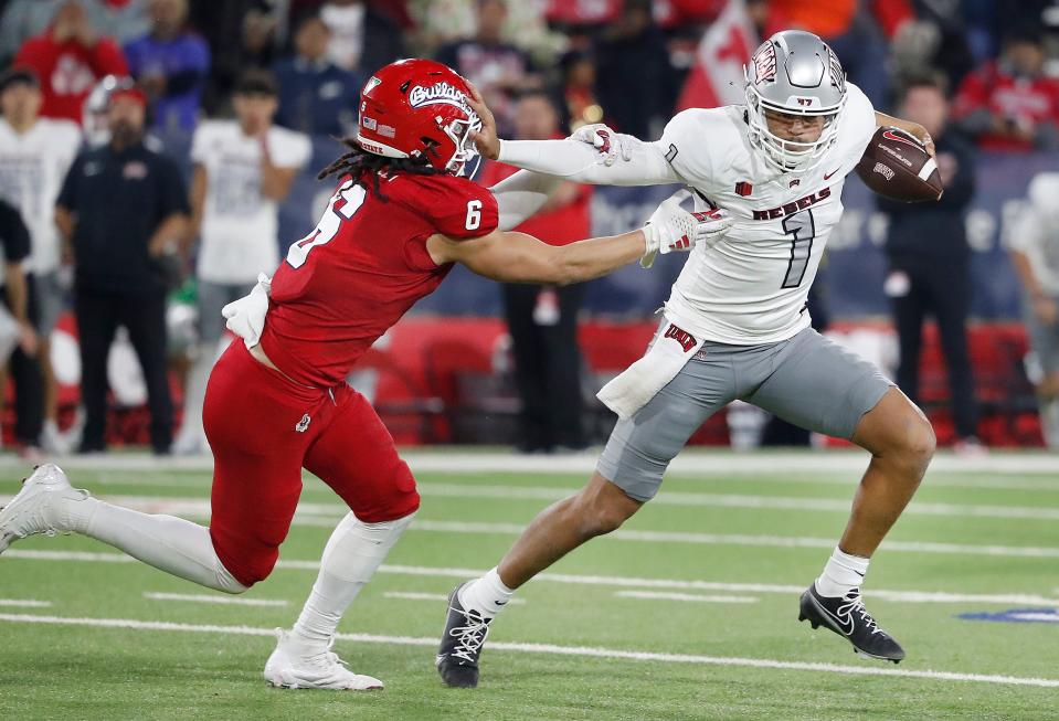 UNLV's quarterback Jayden Maiava tried unsuccessfully to escape the sack from Fresno State's Levelle Bailey during their NCAA football game at Valley Children's Stadium in Fresno, Calif, Saturday, Oct. 28, 2023. Fresno State won 31-24 in front of a sellout crowd.