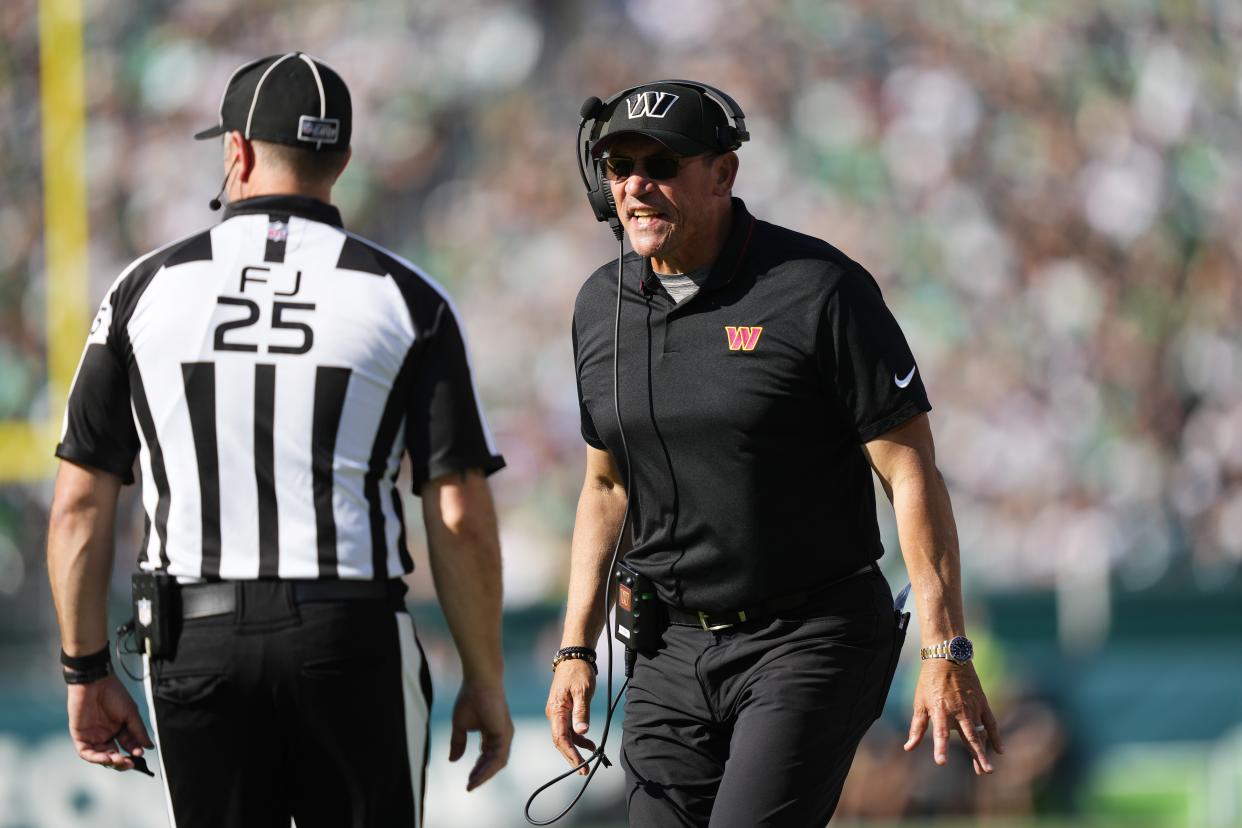 Washington Commanders head coach Ron Rivera speaks with an official during the second half of an NFL football game against the Philadelphia Eagles on Sunday, Oct. 1, 2023, in Philadelphia. (AP Photo/Matt Rourke)