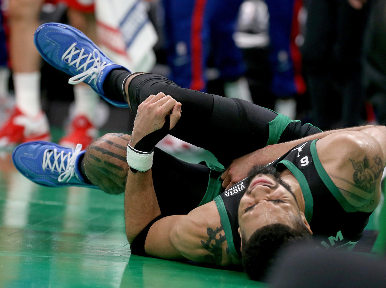 Boston Celtics forward Jayson Tatum goes down during the second half of Game 1 of the Eastern Conference semifinals against the Philadelphia 76ers at TD Garden in Boston on May 1, 2023. (Photo by Matt Stone/MediaNews Group/Boston Herald via Getty Images)