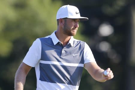 Sep 25, 2016; Atlanta, GA, USA; Kevin Chappell reacts after putting the fifteenth hole during the final round of the Tour Championship at East Lake Golf Club. Mandatory Credit: Butch Dill-USA TODAY Sports