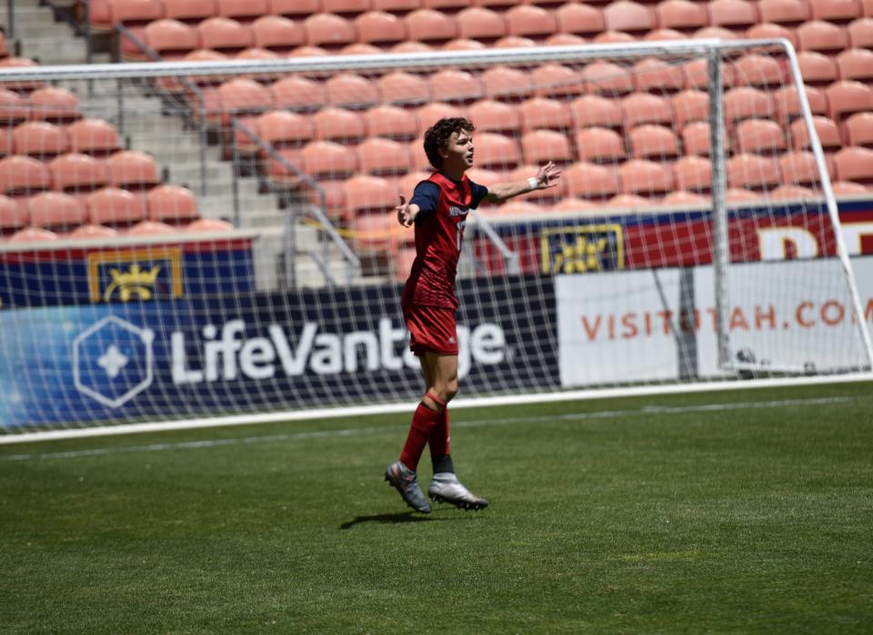 Crimson Cliffs player Ryan Woolley celebrates after scoring the "Golden Goal" that gave the Mustangs the state title on Wednesday in a win over Ridgeline at Rio Tinto Stadium in Sandy.
