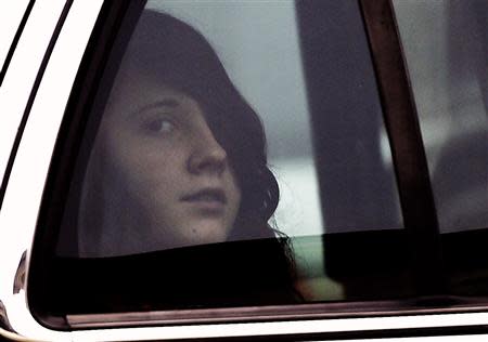 Miranda Barbour, 19, the woman dubbed the so-called Craigslist killer suspect, looks out of the window from a sheriff's car after appearing in court in Sunbury, Pennsylvania April 1, 2014. REUTERS/Mark Makela