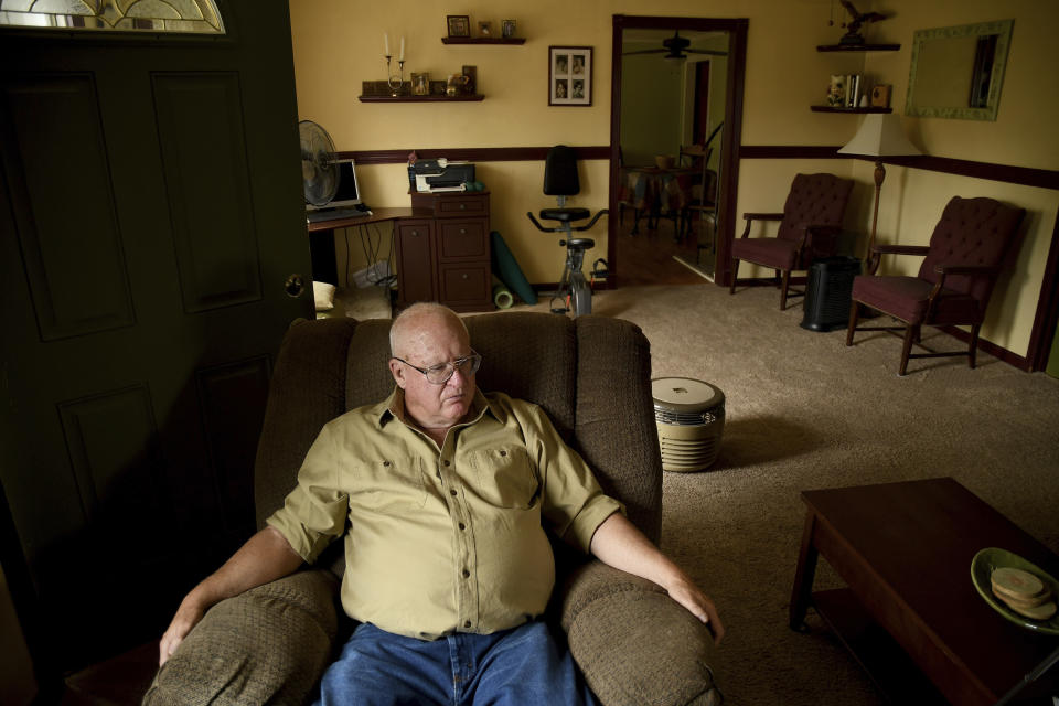 Donn Edmunds, a 25-year U.S. Army veteran who served in Vietnam, sits in his living room in Cheyenne, Wyo., Wednesday, Sept. 1, 2021. Edmunds' son, Army Ranger Spc. Jonn Edmunds, and another soldier died when a Black Hawk helicopter on a search-and-rescue mission crashed in Pakistan in October 2001. They were among the first U.S. casualties in the Afghanistan war. (AP Photo/Thomas Peipert)