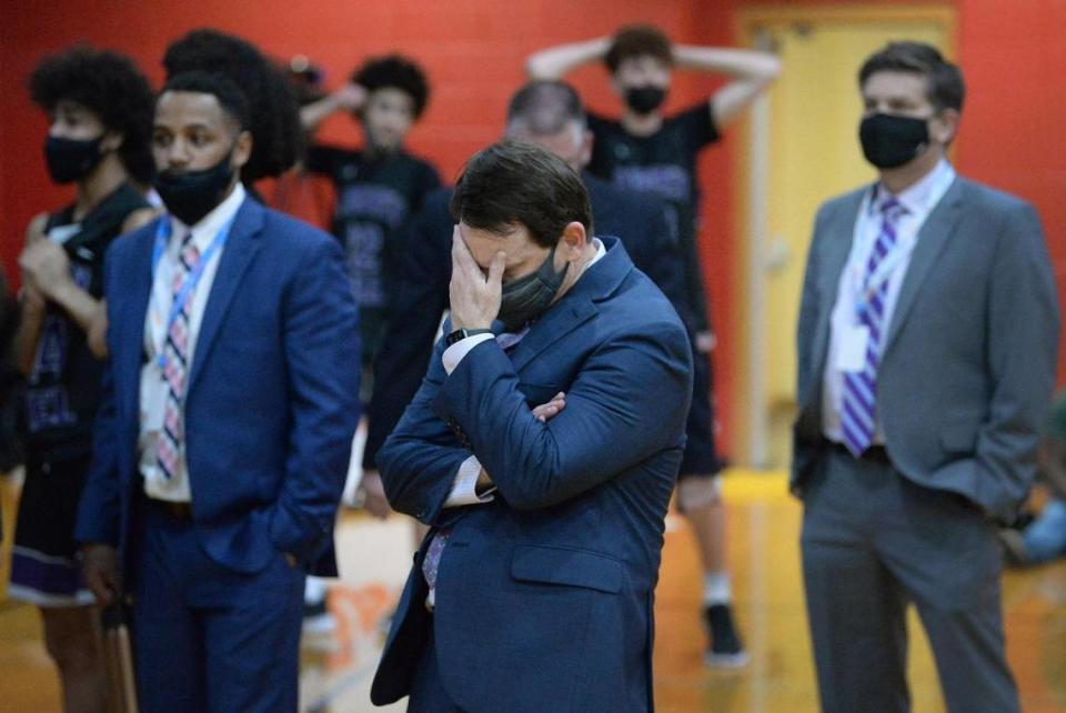 Ardrey Kell head basketball coach Mike Craft, his staff and team react to their loss to Millbrook in the Boys NCHSAA championship game at Wheatmore High School in Trinity, NC on Saturday, March 6, 2021. Millbrook defeated Ardrey Kell, 67-65, in overtime.