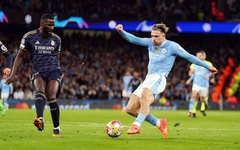 Jack Grealish has an attempt blocked by Antonio Rudiger