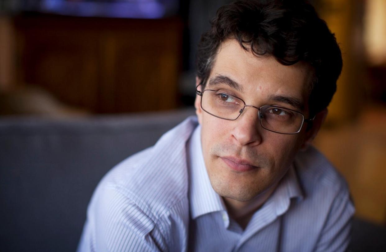 Steven Galloway is pictured here in March 2014, in what was his office at the University of British Columbia in Vancouver. B.C.'s Court of Appeal says the author's defamation claims against a former graduate student and her supporters should be allowed to move to trial. (Ben Nelms/CBC - image credit)