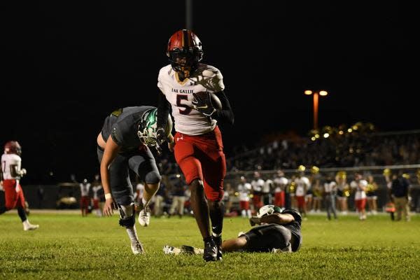 After evading last minute tackle attempts from two Hawks, Eau Gallie's Robert Stafford (5) strolls into the endzone for the team's third touchdown of the night.