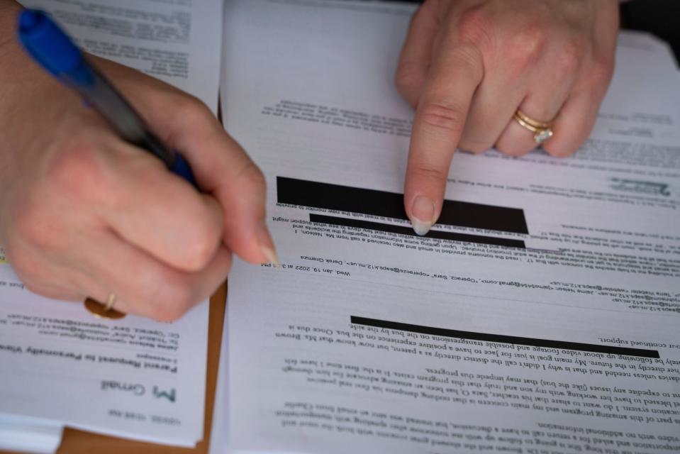 Attorney Danielle Canepa reviews email exchanges between her client Nelson-Molnar and Ann Arbor Public School employees at her office in Royal Oak on July 14, 2023. Nelson-Molnar is suing the Ann Arbor Public Schools after her son with autism was assaulted by a school bus aide when he was 7 years old.