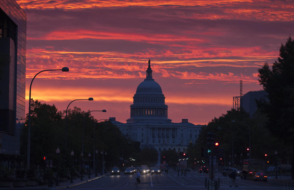 The Capitol dome is silhouetted as the sun rises in Washington, Monday, Oct. 15, 2012. (AP Photo/J. Scott Applewhite)