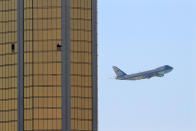 <p>OCT. 4, 2017 – Air Force One departs Las Vegas past the broken windows on the Mandalay Bay hotel, where shooter Stephen Paddock conducted his mass shooting along the Las Vegas Strip in Las Vegas, Nevada. (Photo: Mike Blake/Reuters) </p>