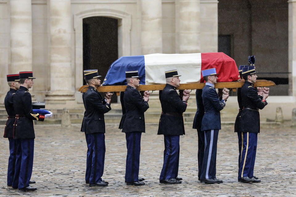 Holding the casket