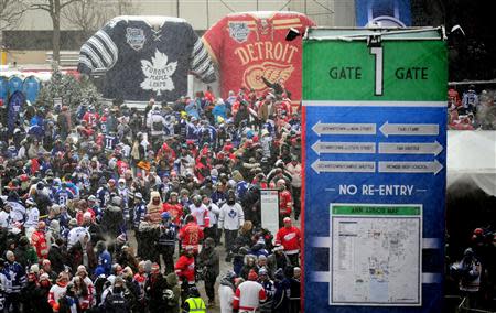 NHL fans wait outside gate one prior to the start of the 2014 Winter Classic hockey game between the Toronto Maple Leafs and Detroit Red Wings at Michigan Stadium. Mandatory Credit: Andrew Weber-USA TODAY Sports