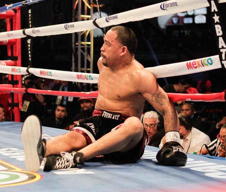 James Kirkland sits in the ring after being knocked out by Saul &quot;Canelo&quot; Alvarez during the third round of their 154-pound boxing bout Saturday, May 9, 2015, in Houston. (AP Photo/Bob Levey)