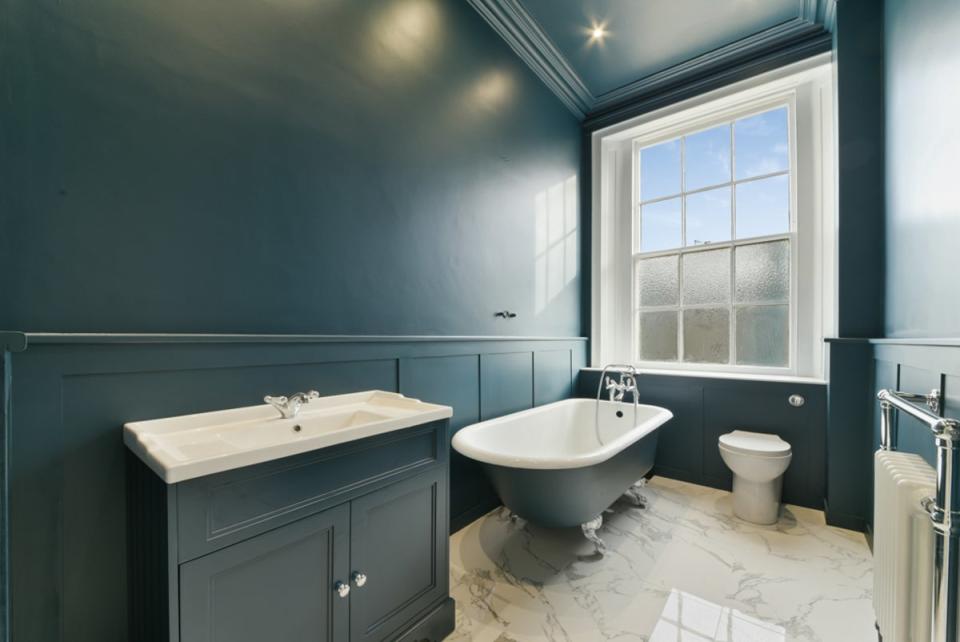 The newly renovated bathroom with its roll top tub (Barnard Marcus)