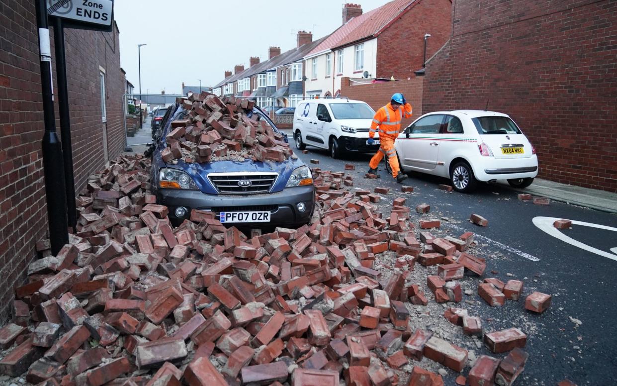 A damaged car on Gloucester Avenue in Roker, Sunderland - PA