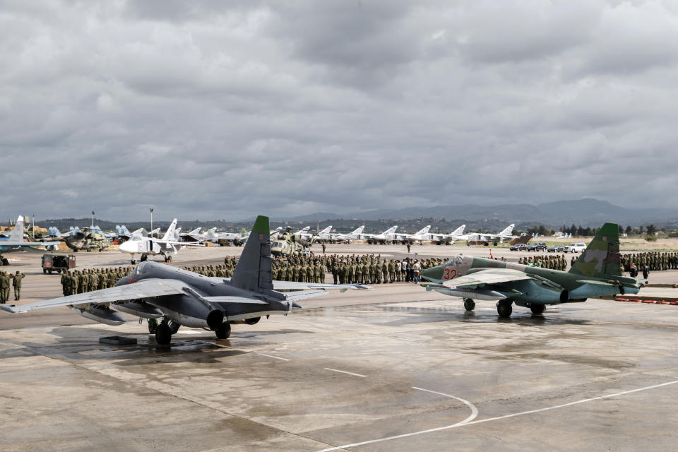 FILE - In this file photo provided on Tuesday, March 15, 2016, by the Russian Defense Ministry Press Service, a lineup of Russian troops is held before withdrawal at Hemeimeem air base in Syria. A Syrian-led human rights group said Wednesday, Oct. 31, 2018 that it has documented more than 1,400 incidents in which Russian forces indiscriminately targeted civilians and civilian infrastructure in the three years since Moscow intervened in the civil war in Syria. (Vadim Grishankin/Russian Defense Ministry Press Service via AP, file)