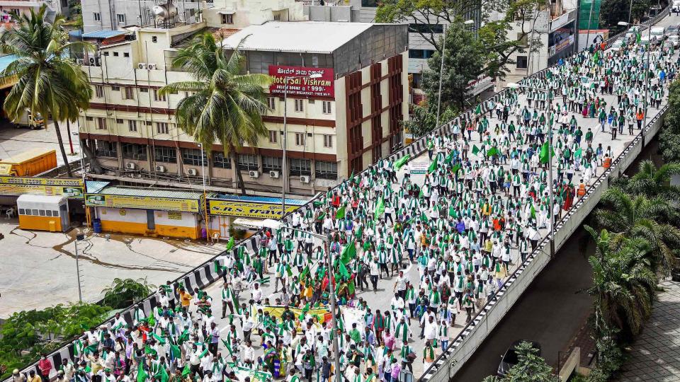 Karnataka State Farmers Association members take part in a protest rally against the State Government over their various demands, in Bengaluru, Monday, 21 September 2020.