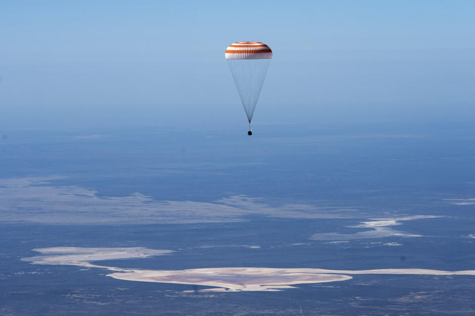 In this handout photo released by Gagarin Cosmonaut Training Centre (GCTC), Roscosmos space agency, the Soyuz MS-15 space capsule carrying International Space Station (ISS) crew members descends beneath a parachute just before landing in a remote area near Kazakh town of Dzhezkazgan, Kazakhstan, Friday, April 17, 2020. An International Space Station crew has landed safely after more than 200 days in space. The Soyuz capsule carrying NASA astronauts Andrew Morgan, Jessica Meir and Russian space agency Roscosmos' Oleg Skripochka touched down on Friday on the steppes of Kazakhstan. (Andrey Shelepin, Gagarin Cosmonaut Training Centre (GCTC), Roscosmos space agency, via AP)