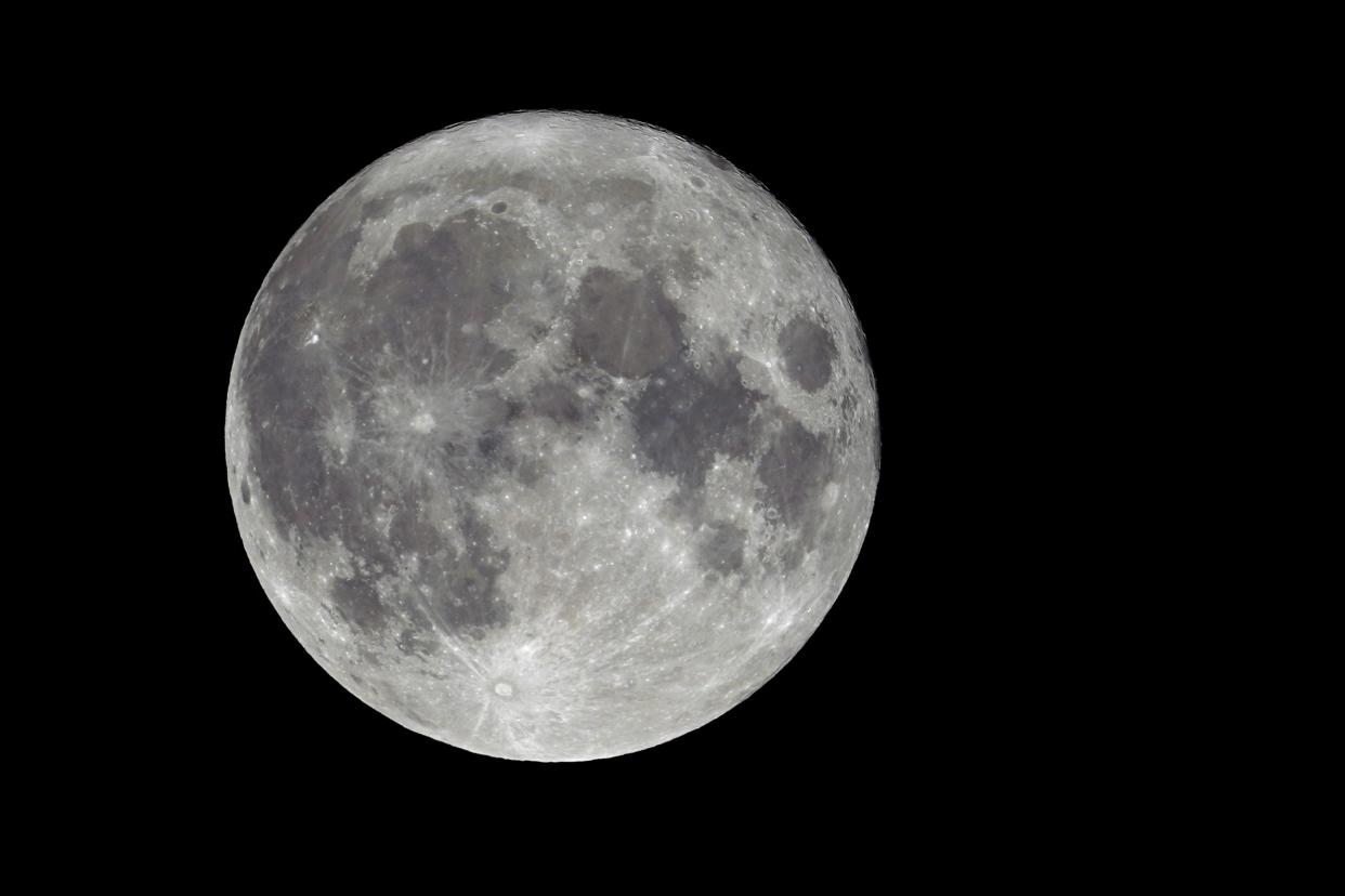 Craters and other markings are visible as the supermoon rises from Olympia, Wash., on Thursday, Aug. 11, 2022. This full moon is also known as the sturgeon supermoon and is the last of four supermoons — which occur when the moon is full at its closest location to the earth — in 2022.
