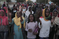 People protest in Khartoum, Sudan, two days after a military coup, Wednesday, Oct. 27, 2021. The coup threatens to halt Sudan's fitful transition to democracy, which began after the 2019 ouster of long-time ruler Omar al-Bashir and his Islamist government in a popular uprising. It came after weeks of mounting tensions between military and civilian leaders over the course and pace of that process. (AP Photo/Marwan Ali)