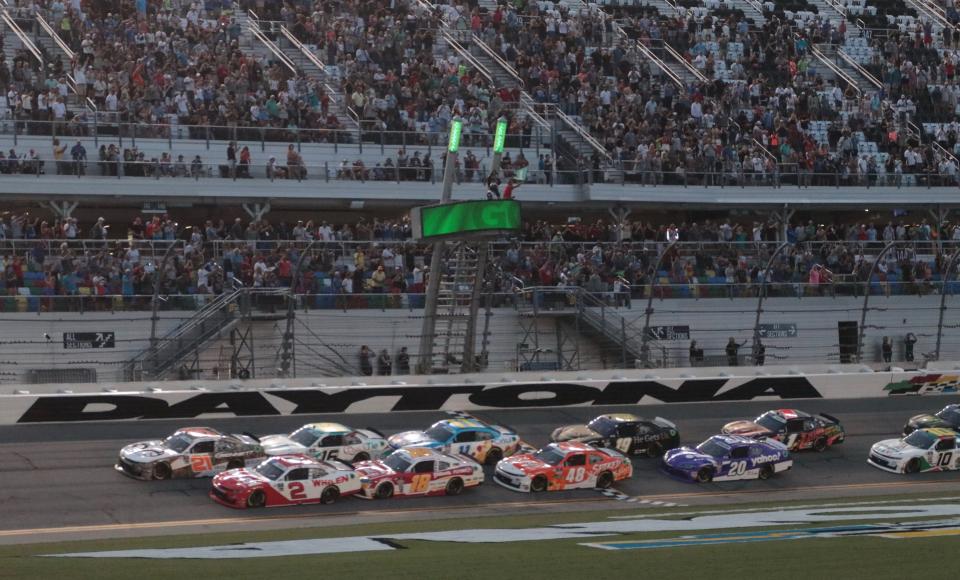 Austin Hill (21) and Sheldon Creed (2) lead the field to the green flag on Friday night in the Xfinity Series Wawa 250.