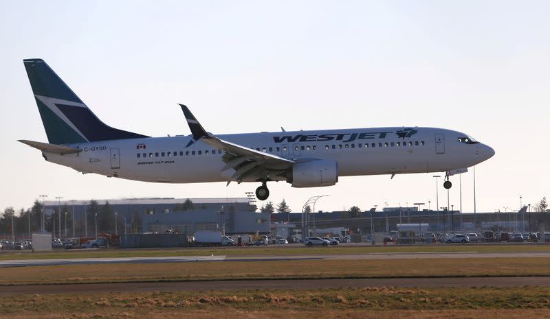FILE PHOTO: A WestJet Boeing 737 airplane lands at Vancouver's international airport in Richmond,