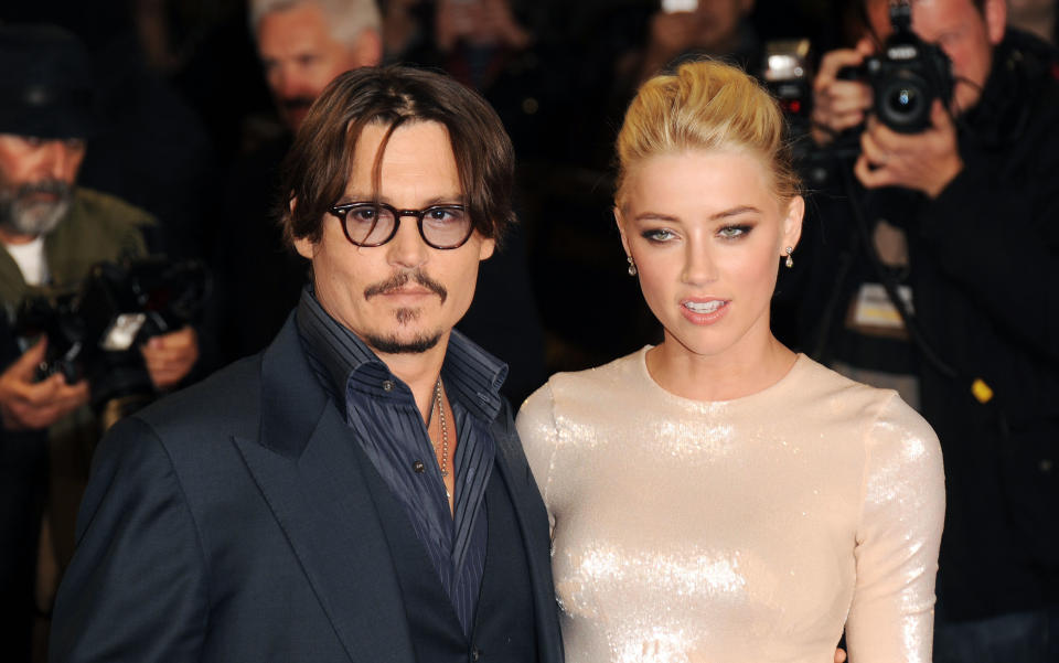 LONDON, UNITED KINGDOM - NOVEMBER 03: Johnny Depp and Amber Heard attend The UK Premiere of 'The Rum Diary' at  on November 3, 2011 in London, England. (Photo by Stuart Wilson/Getty Images)