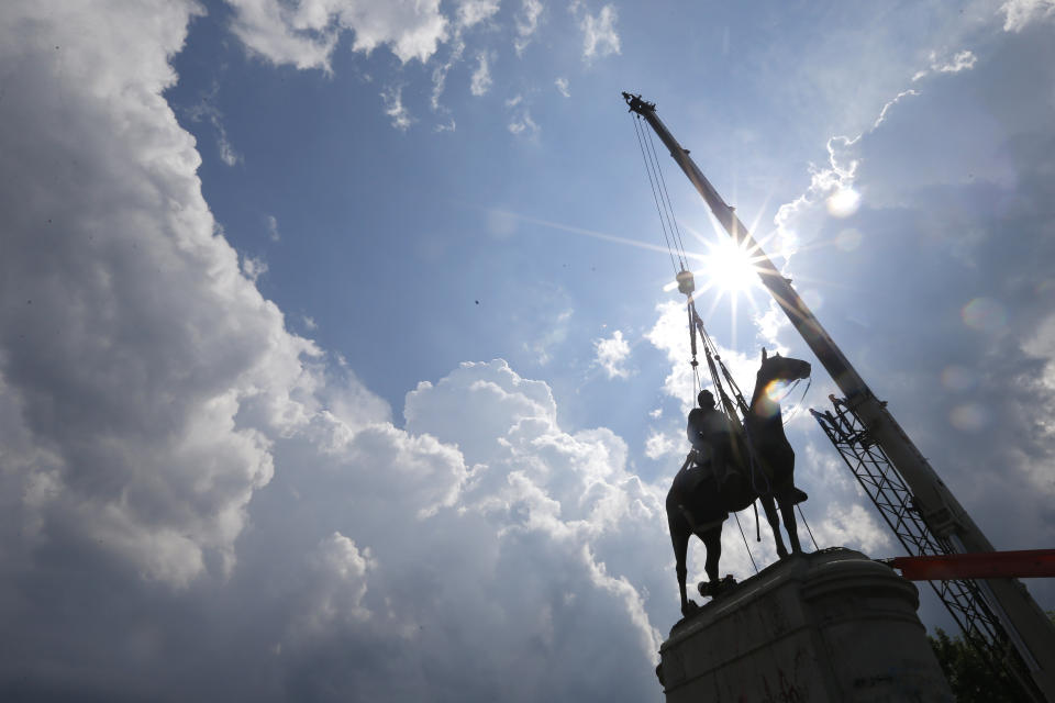 FLE - A crew removes the statue of Confederate Gen. Stonewall Jackson, July 1, 2020, in Richmond, Va. The Virginia NAACP filed a lawsuit on Tuesday, June 11, 2024, against Shenandoah County’s school board over its recent reinstatement of Confederate military names to two schools, including a high school named after Stonewall Jackson. (AP Photo/Steve Helber, File)