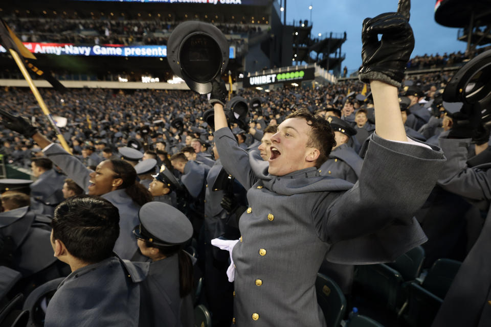 Army Cadet Cpl. Andrew Sanchez, of Carmel, Ind., celebrates when Army takes the lead 7-3 in the second quarter of an NCAA college football game in Philadelphia, Saturday, Dec. 10, 2022. (Elizabeth Robertson/The Philadelphia Inquirer via AP)