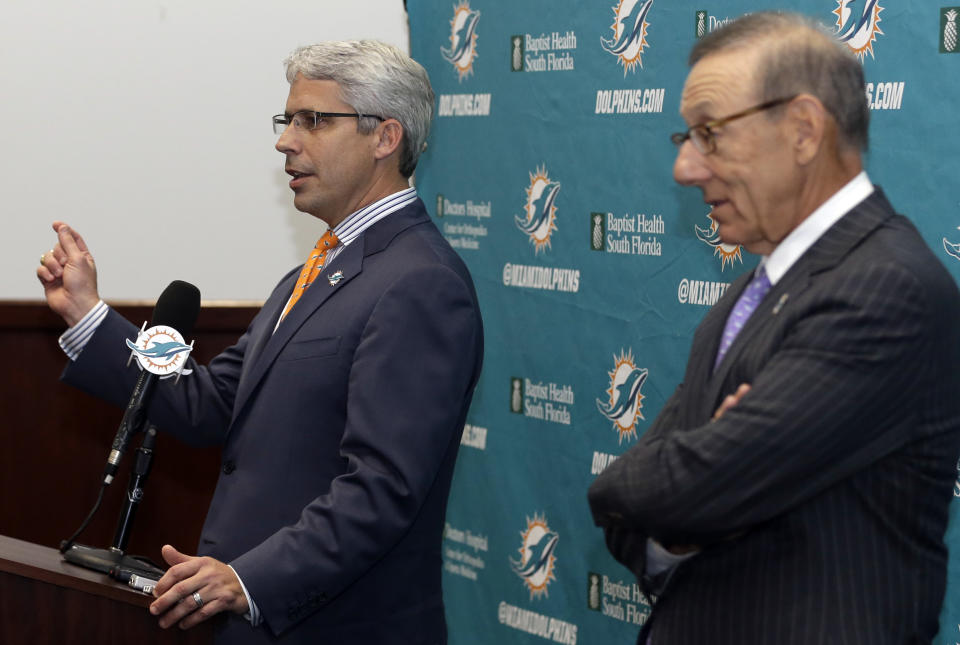 Dennis Hickey, left, the new general manager for the Miami Dolphins NFL football team, speaks after being introduced during a news conference by team owner Stephen Ross, right, Tuesday, Jan. 28, 2014, in Davie, Fla. (AP Photo/Lynne Sladky)