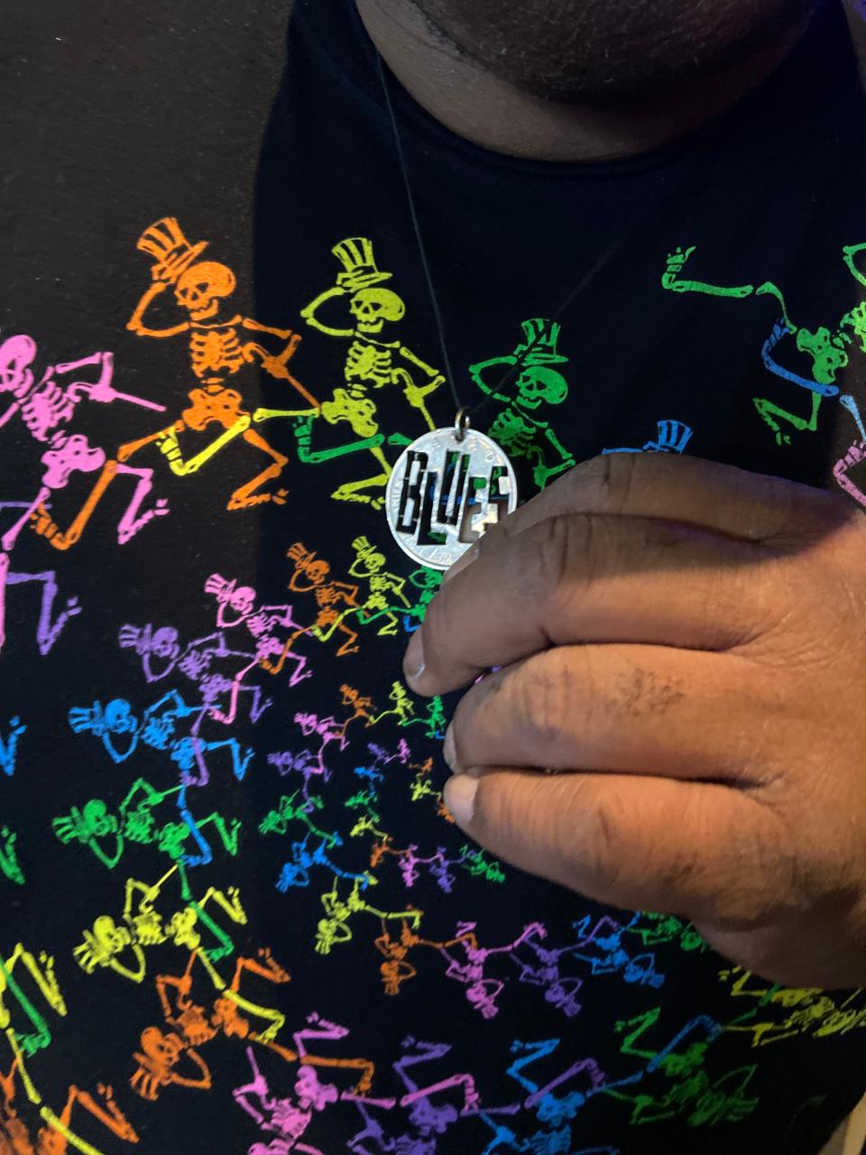 Before his show at The Majestic, Larry McCray shows off his necklace from his friend who's in his own band, Washboard Steve, in Alabama.