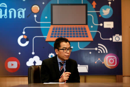 FILE PHOTO: Sawang Boonmee, deputy secretary-general of Election Commission talks as he works in a social media war room in Bangkok, Thailand March 8, 2019. REUTERS/Soe Zeya Tun