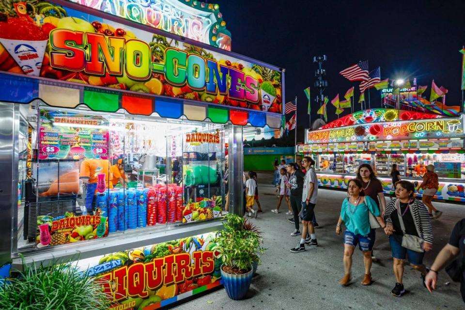 Sno-Cones, Candy Apples and Popcorn booths are illuminated during the 2024 Miami-Dade County Youth Fair & Exposition. The theme of the 72nd edition is “Spaceventure,” held in Miami on Thursday, March 14, 2024.