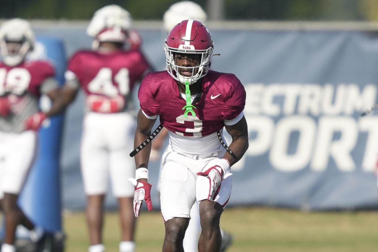 Alabama defensive back Terrion Arnold warms up before a game.