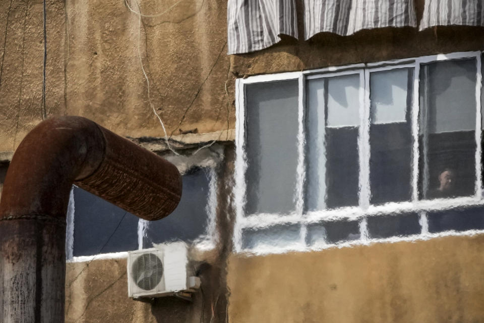 An exhaust pipe from a diesel generator spouts fumes near a residential building in Beirut, Lebanon, March 4, 2022. Private generators are ubiquitous in parts of the Middle East, spewing hazardous fumes into homes and business across the country, almost 24 hours a day. As the world looks for renewable energy to tackle climate change, Lebanon, Iraq, Gaza and elsewhere rely on diesel-powered private generators just to keep the lights on. The reason is state failure: In multiple countries, governments can’t maintain a functioning central power network, whether because of war, conflict or mismanagement and corruption. (AP Photo/Hassan Ammar)