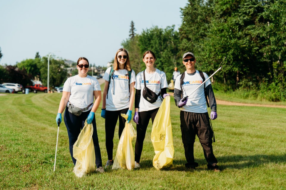 Members of the Base Plant tailings team volunteering at Birchwood Trails in Fort McMurray as part of the SunCares program founded by the Suncor Energy Foundation.