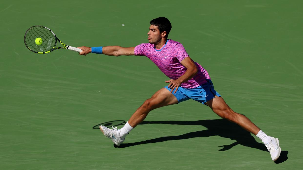  Carlos Alcaraz of Spain plays a forehand against Fabian Marozsan of Hungary in their fourth round match during the BNP Paribas Open at Indian Wells Tennis Garden . 