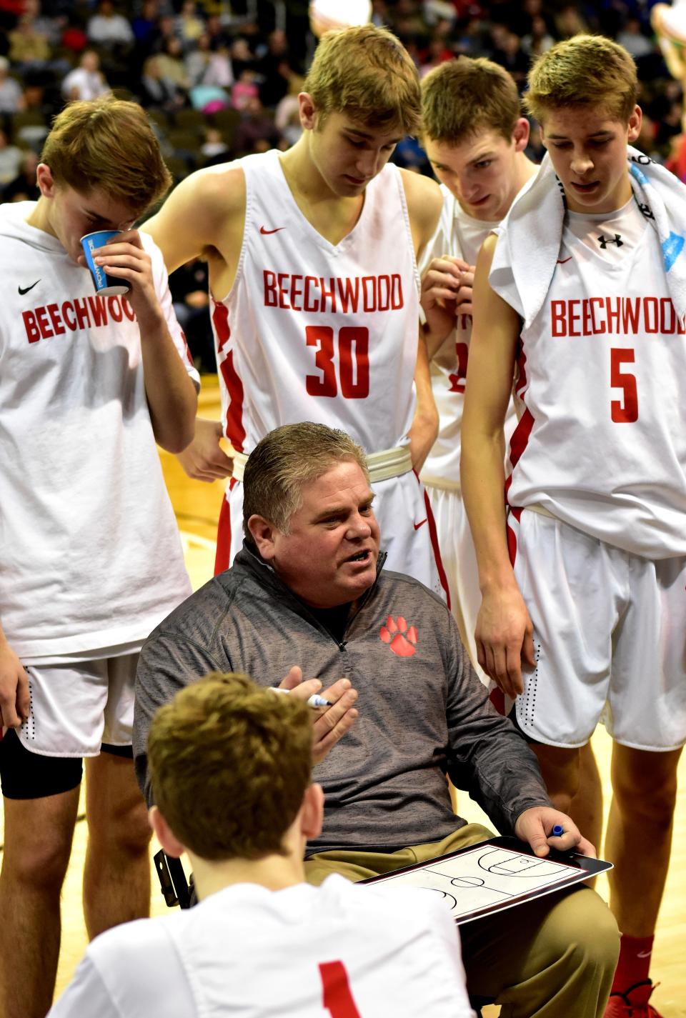 Beechwood coach Erik Goetz works up a defensive plan during a Tigers timeout in the KHSAA Ninth Region basketball quarterfinals at BB&T Arena, Feb. 25, 2019.