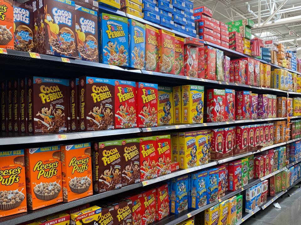 aisle at walmart full of different kinds of cereal