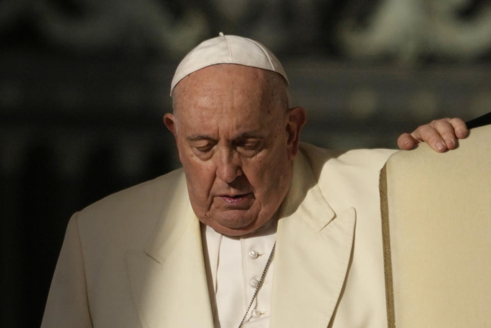 FILE - Pope Francis arrives for his weekly general audience in St. Peter's Square, at the Vatican, Wednesday, Nov. 22, 2023. Pope Francis cancelled his trip to Dubai for the U.N. climate conference on doctors’ orders. The announcement marked the second time the pope’s frail health had forced the cancellation of a foreign trip: He had to postpone a planned trip to Congo and South Sudan in 2022 because of knee inflammation, though he was able to make the trip earlier this year. (AP Photo/Andrew Medichini, File)