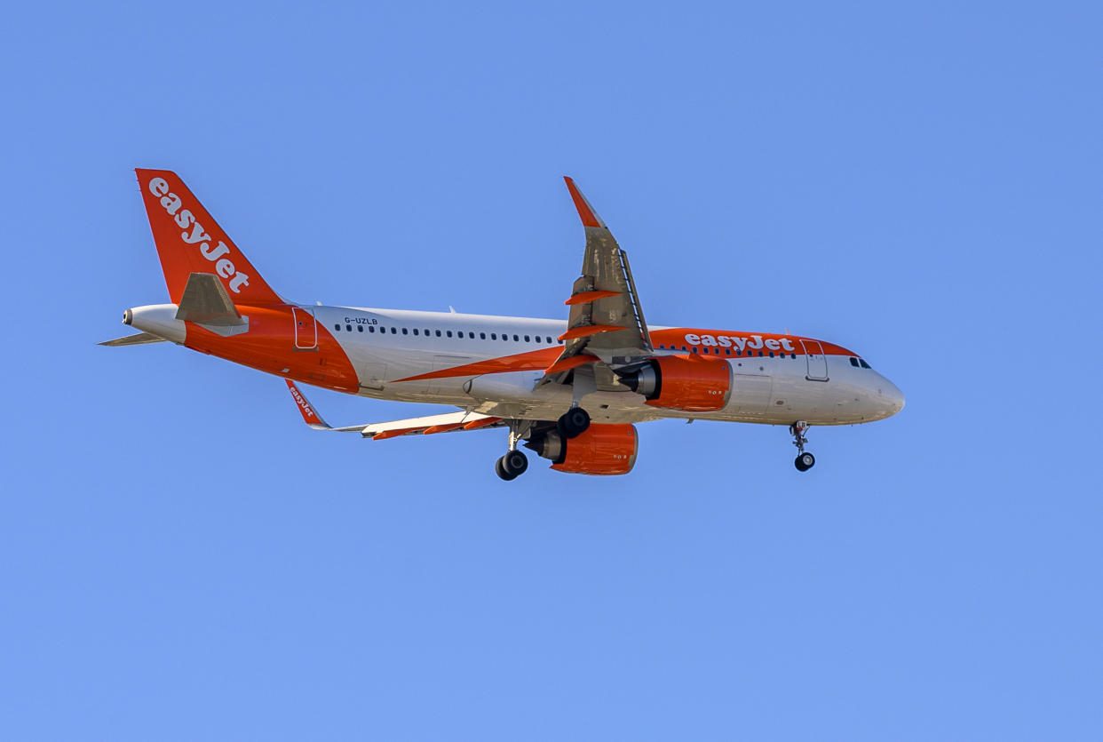 LISBON, PORTUGAL - JANUARY 03: EasyJet G-UZLB Airbus A320 flies over the city while approaching Humberto Delgado International Airport on January 11, 2020 in Lisbon, Portugal. The number of foreign tourists visiting Portugal attained another record in 2019. (Photo by Horacio Villalobos#Corbis/Corbis via Getty Images)