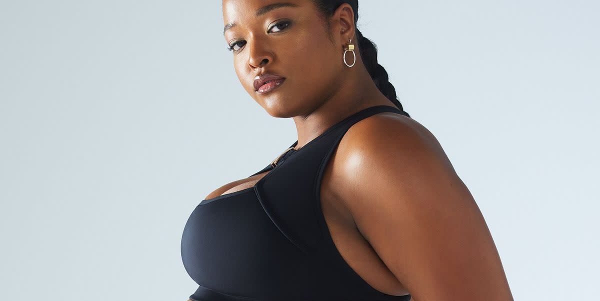 a black woman wearing a black sports bra