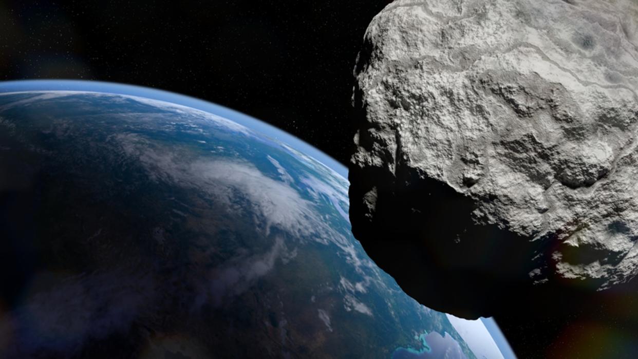  An asteroid flying past earth. 