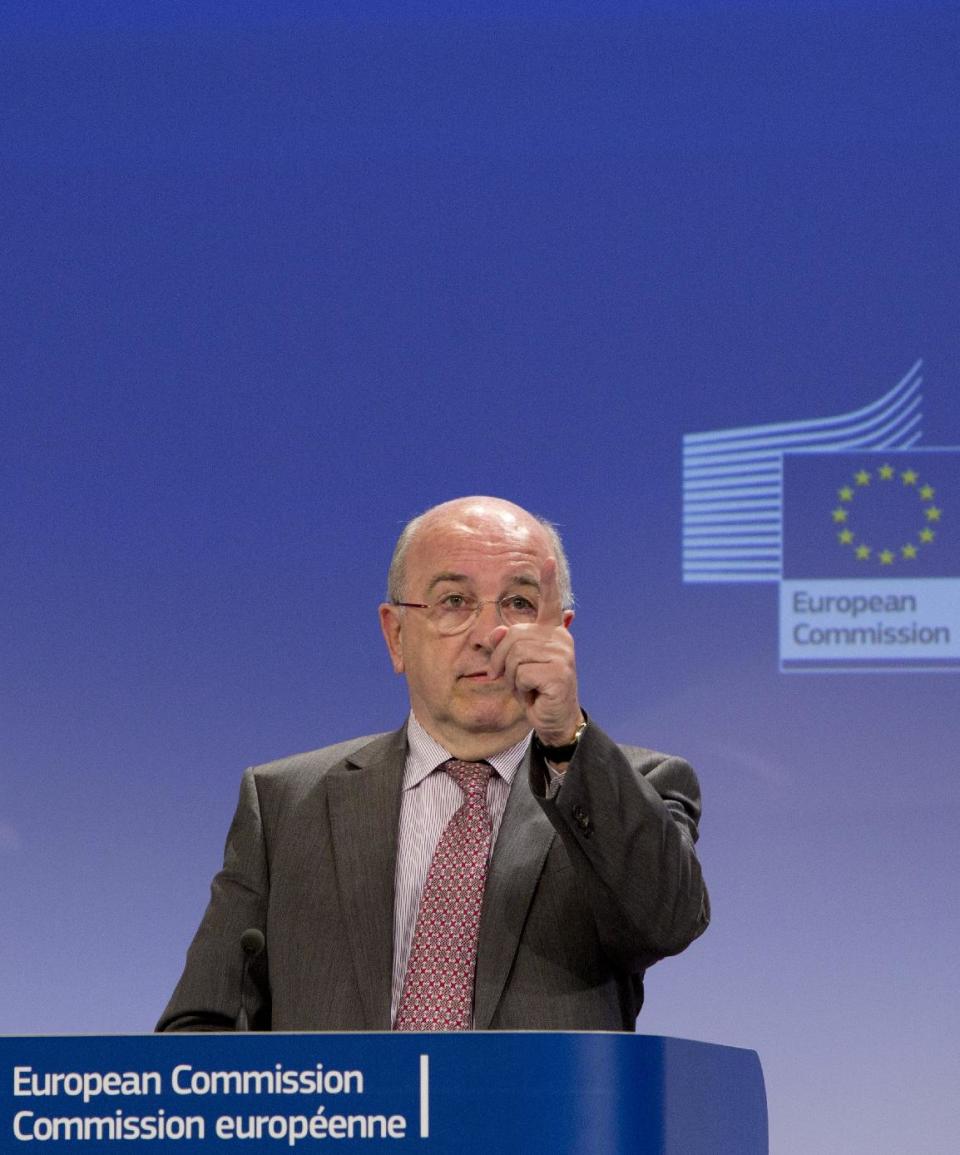 European Commissioner for Competition Joaquin Almunia gestures while speaking during a media conference at EU headquarters in Brussels, Monday, Jan. 13, 2014. The European Union's antitrust watchdog says it has opened an investigation on licensing agreements between several major U.S. film studios and European pay TV broadcasters. Its probe covers Twentieth Century Fox, Warner Bros., Sony Pictures, NBCUniversal and Paramount Pictures. (AP Photo/Virginia Mayo)