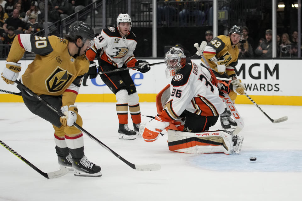 Vegas Golden Knights center Chandler Stephenson (20) scores past Anaheim Ducks goaltender John Gibson (36) during the second period of an NHL hockey game Saturday, Oct. 14, 2023, in Las Vegas. (AP Photo/John Locher)