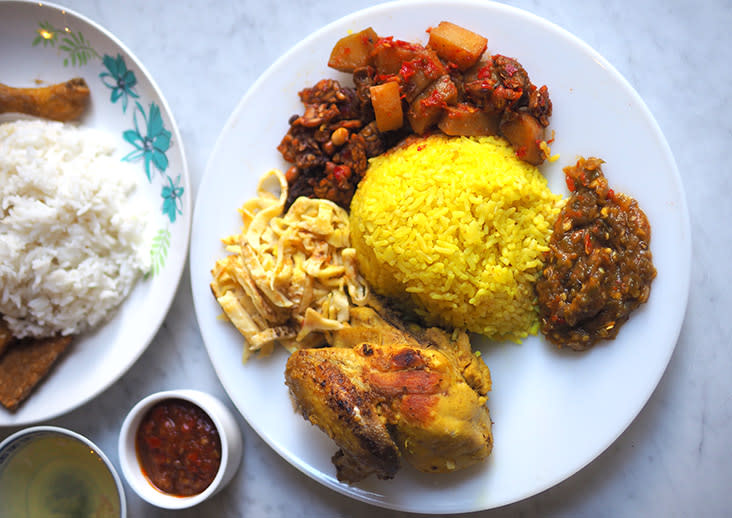 'Nasi kuning' is another must-eat here paired with 'ayam bakar', 'tempe', diced potatoes, shredded omelette and a super addictive 'sambal balado'