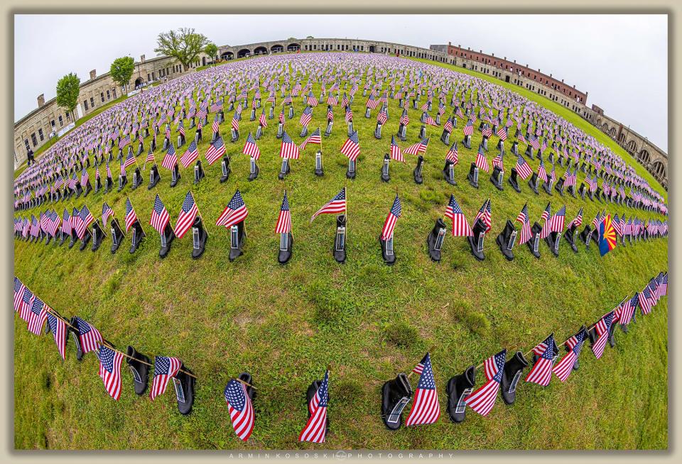 The Boots on the Ground for Heroes Memorial, laid out at Fort Adams, depicts more than 7,000 boots adorned with flags and name placards representing all U.S. service members killed in action post 9-11 in the Global War on Terror.