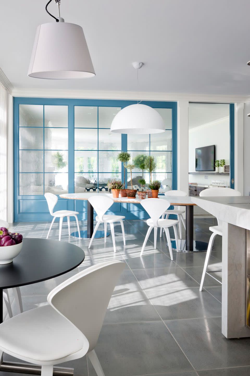 <p>Painting French doors robin's egg blue means the kitchen is still all white, but the vitality of blue shines through in this design by Kellie Franklin.</p>