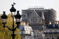 A view shows the Notre-Dame de Paris Cathedral, which was damaged in a devastating fire one year ago, as the coronavirus disease (COVID-19) lockdown slows down its restoration in Paris, France, April 13, 2020. (REUTERS/Charles Platiau)