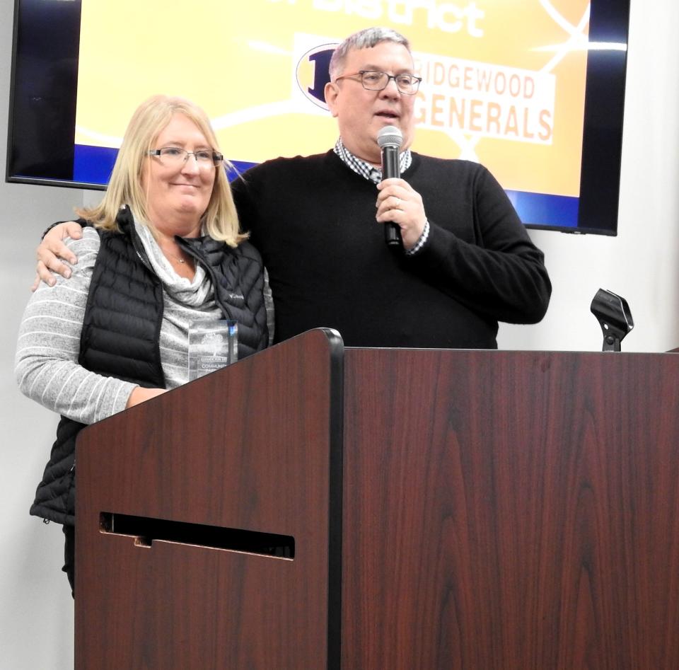 Superintendent Mike Masloski of Ridgewood Local Schools accepts the Community Partner Award with teacher Wendy Croy at the recent Board of Developmental Disabilities annual luncheon. Among connections to the DD community, the school districts made accommodations for Wendy's son, Cody Croy, to compete in the seated shot put event.
